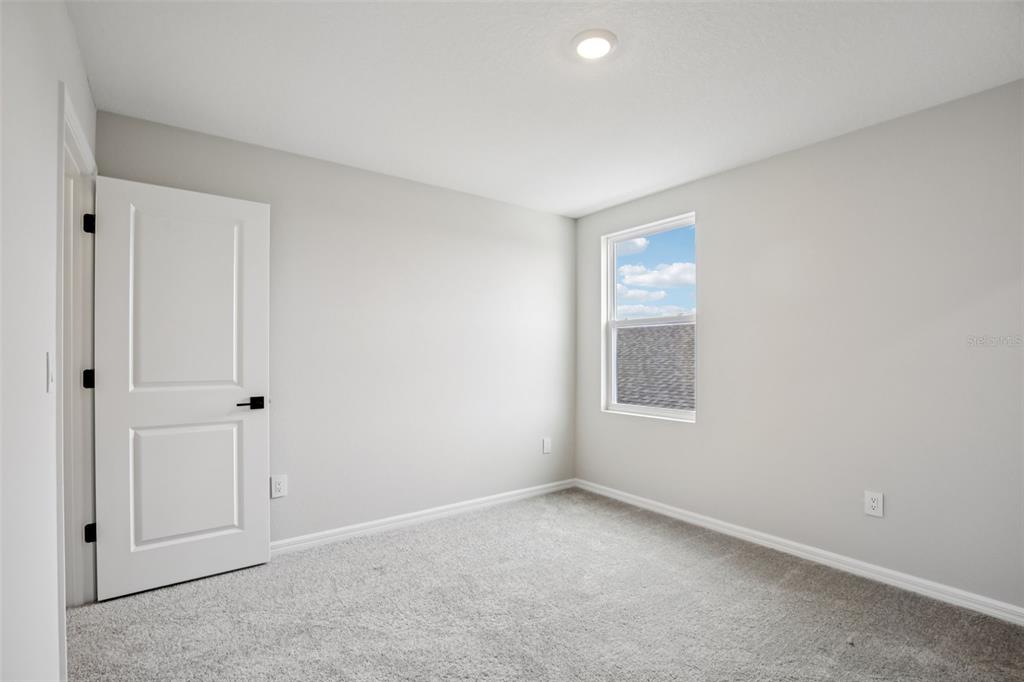 10167 Hidden Hammock Loop Parrish, FL 34221 - Photo 34 of 42 a view of an empty room with a window