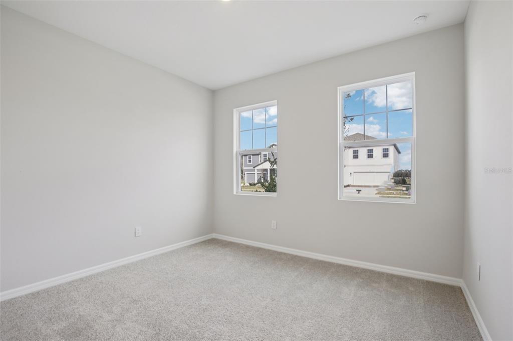 10167 Hidden Hammock Loop Parrish, FL 34221 - Photo 4 of 42 an empty room with windows