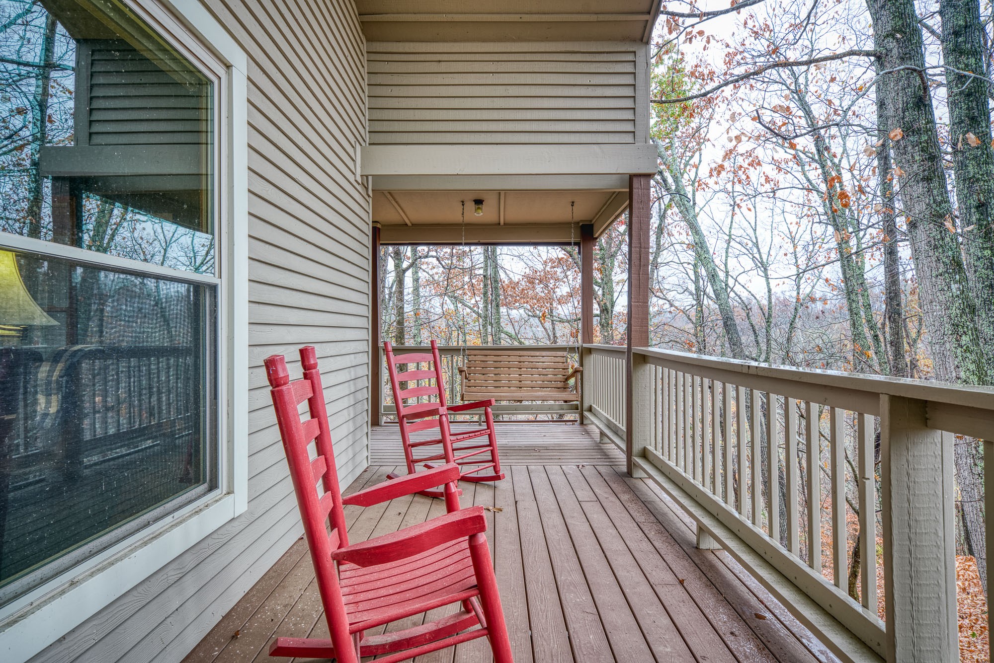 645 Rocky Top Road Sparta, TN 38583 - Photo 17 of 29 a balcony with chairs and wooden fence