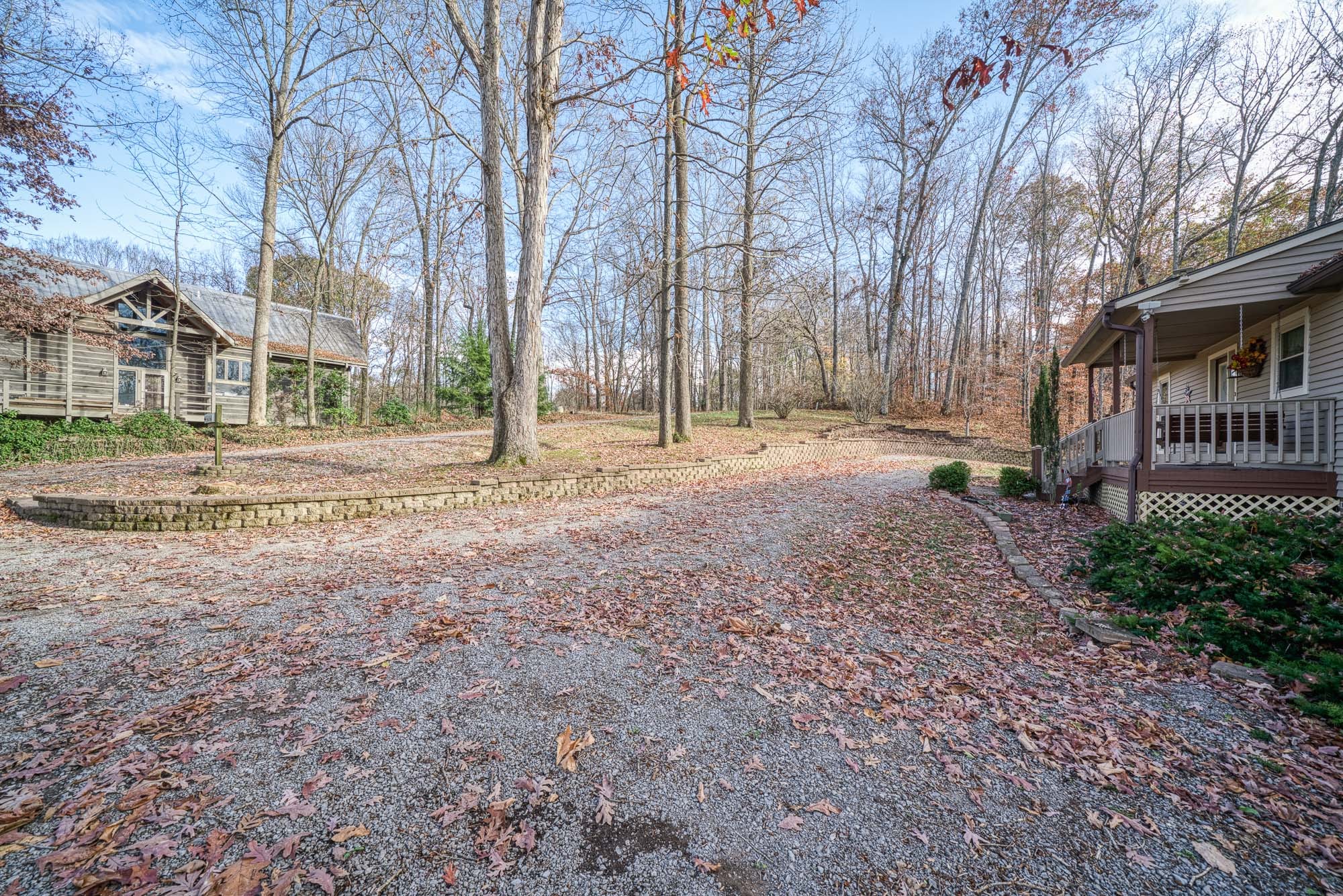 645 Rocky Top Road Sparta, TN 38583 - Photo 18 of 29 a backyard of apartments with large trees