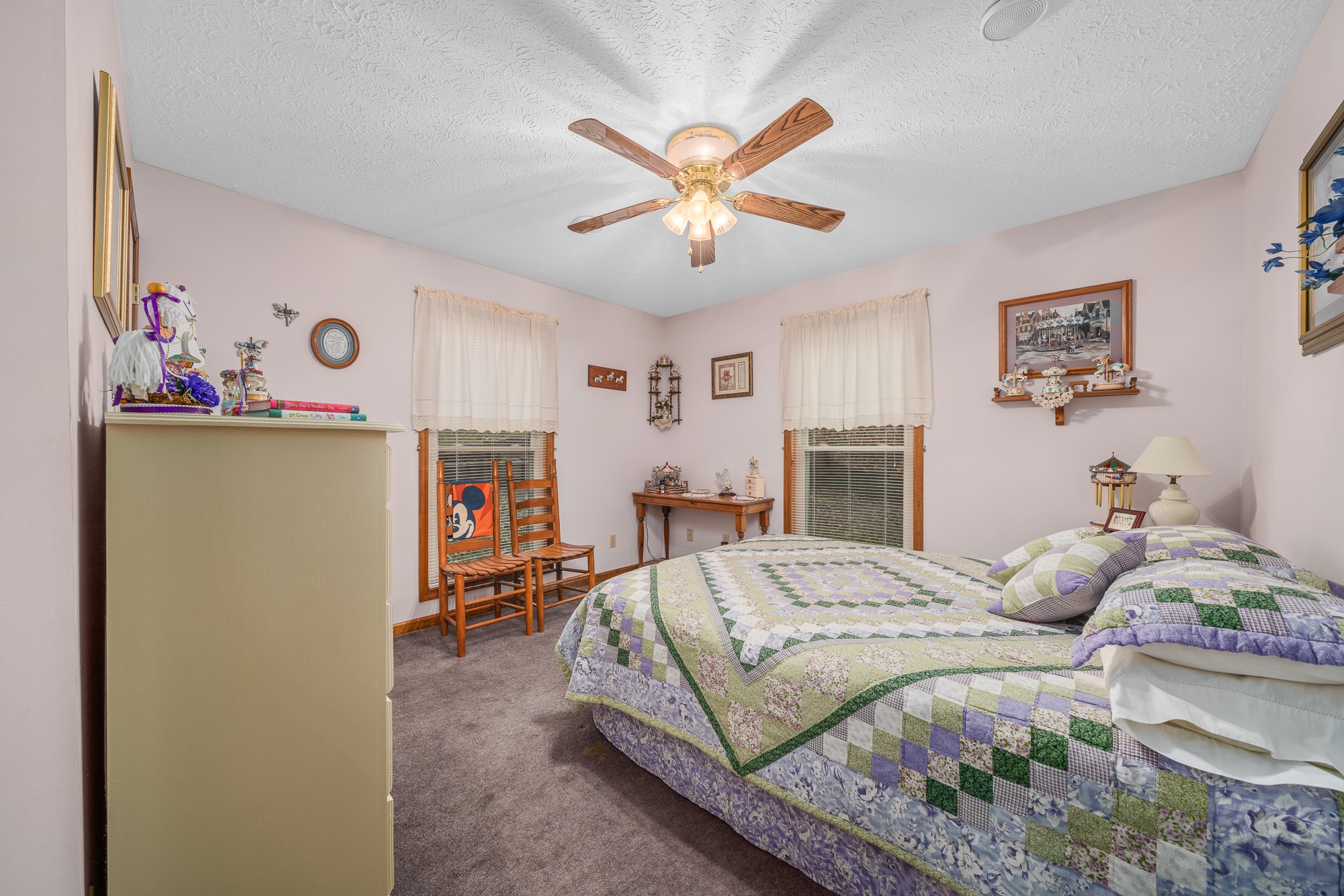 645 Rocky Top Road Sparta, TN 38583 - Photo 20 of 29 a bedroom with a bed and ceiling fan