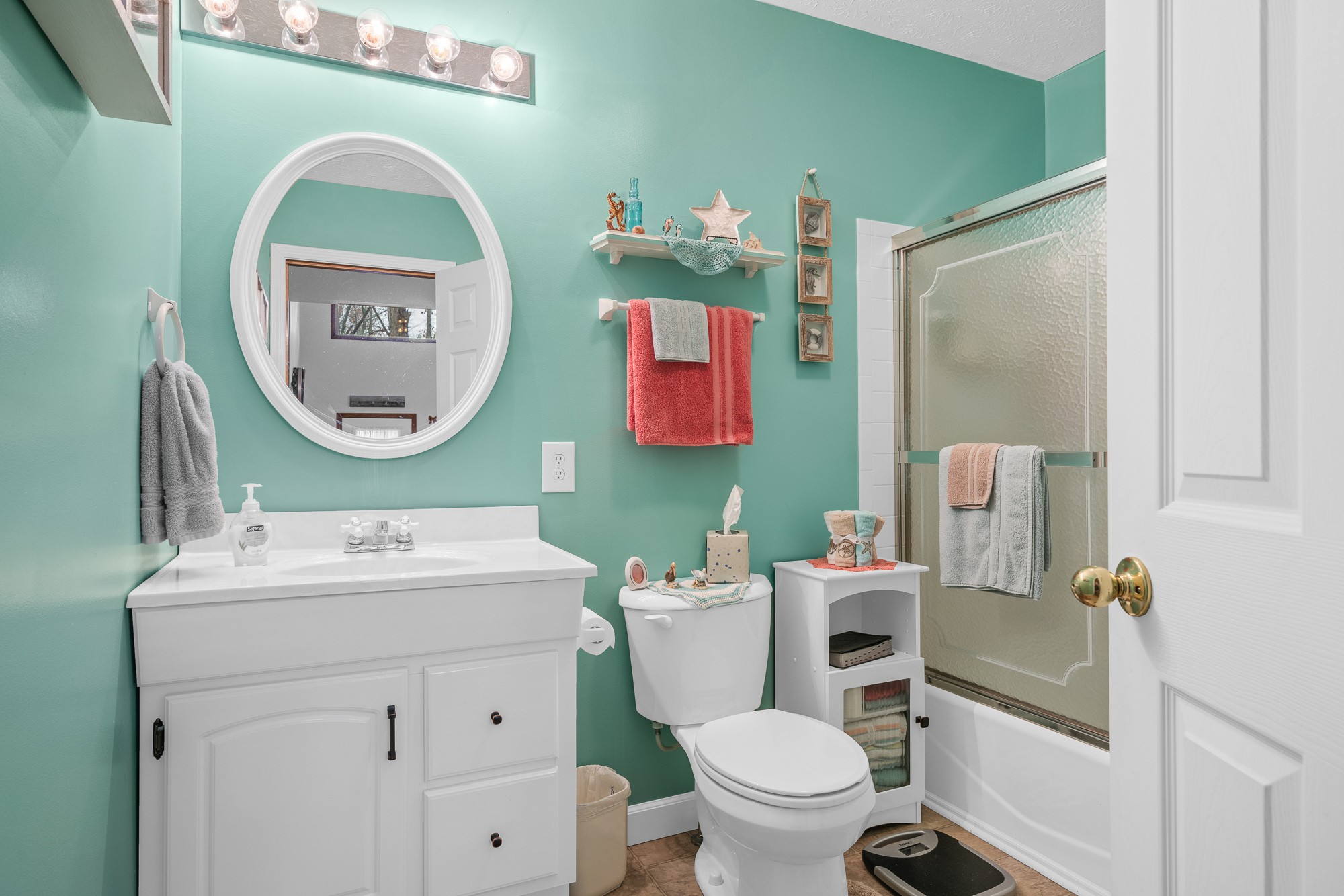 645 Rocky Top Road Sparta, TN 38583 - Photo 21 of 29 a bathroom with a toilet sink and mirror