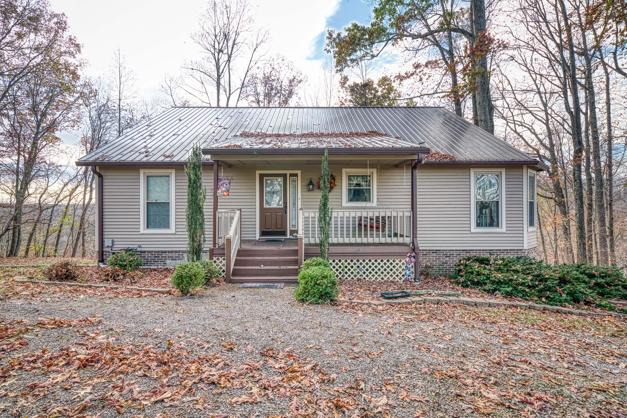 645 Rocky Top Road Sparta, TN 38583 - Photo 8 of 29 a front view of a house with garden