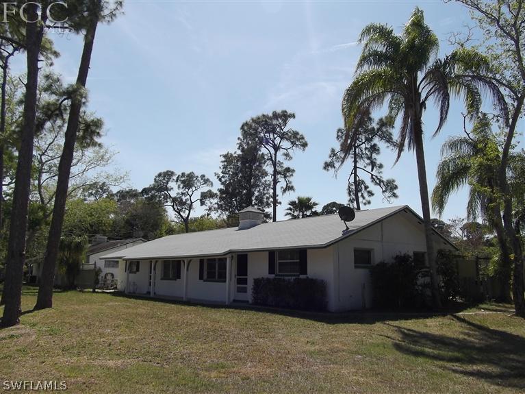 7310 Coon Road North Fort Myers, FL 33917 - Photo 1 of 10 front view of a house with a garden