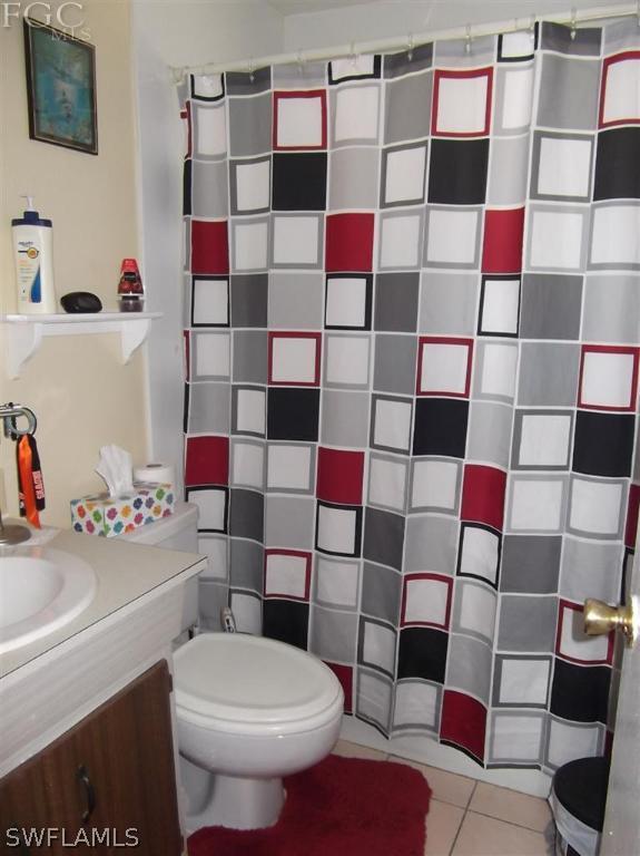 7310 Coon Road North Fort Myers, FL 33917 - Photo 6 of 10 a bathroom with a sink toilet and shower