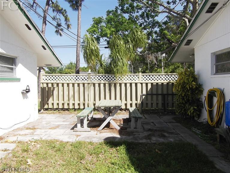 7310 Coon Road North Fort Myers, FL 33917 - Photo 7 of 10 a view of a chair and table in backyard