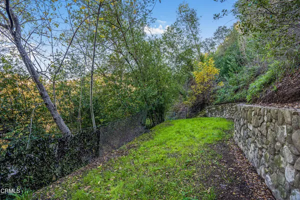 a view of a yard from a balcony