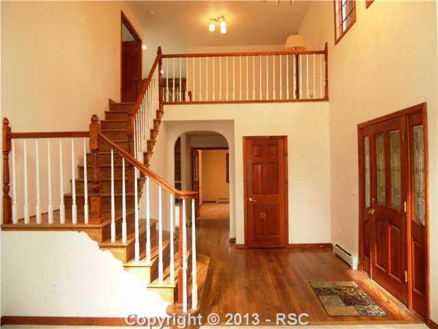 3620 Range View Road Monument, CO 80132 - Photo 3 of 21 Dramatic staircase to loft upstairs