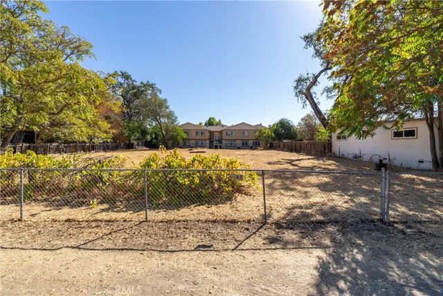 a view of empty space and covered with snow in the background