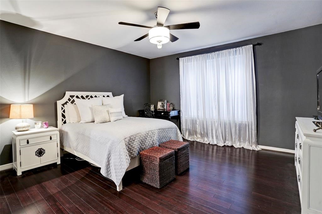 3401 Timmons Lane, Unit 26 Houston, TX 77027 - Photo 12 of 16 a spacious bedroom with a bed and a chandelier