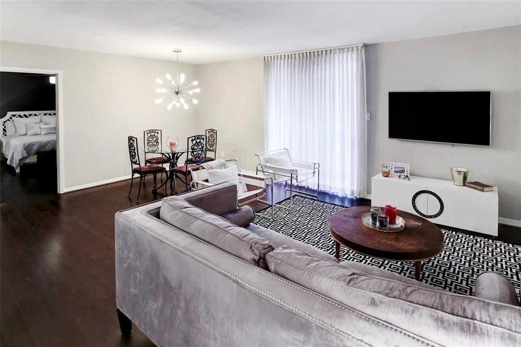 3401 Timmons Lane, Unit 26 Houston, TX 77027 - Photo 5 of 16 a living room with furniture and a flat screen tv