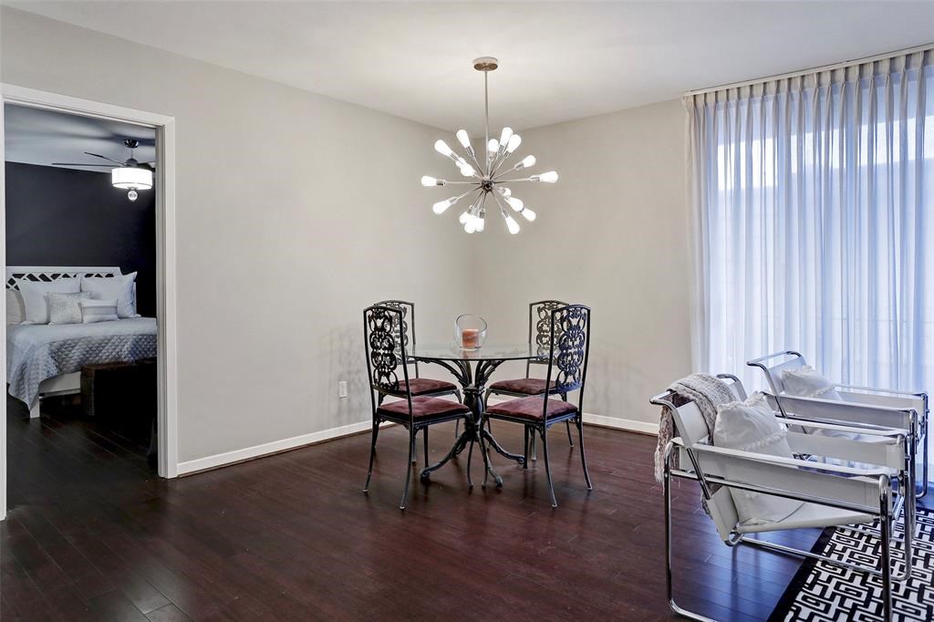 3401 Timmons Lane, Unit 26 Houston, TX 77027 - Photo 6 of 16 a view of a dining room with furniture window and wooden floor