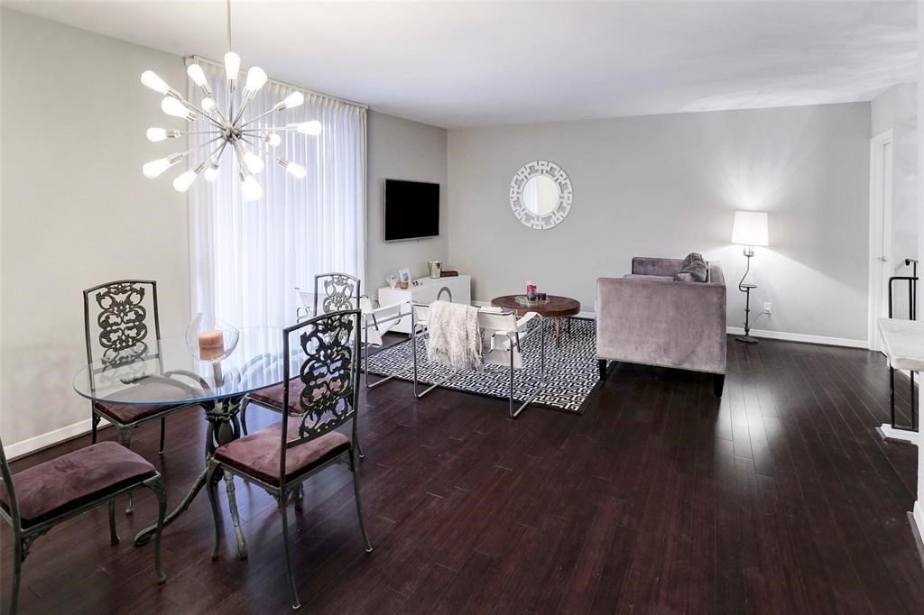 3401 Timmons Lane, Unit 26 Houston, TX 77027 - Photo 7 of 16 a living room with furniture and a flat screen tv