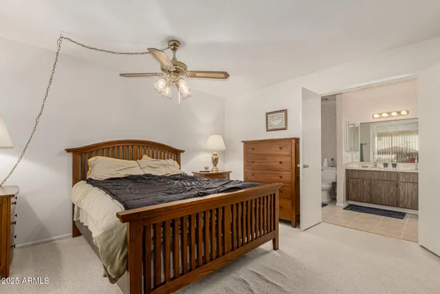 a bedroom with furniture and a dresser