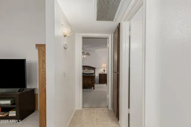 a view of a livingroom from a hallway