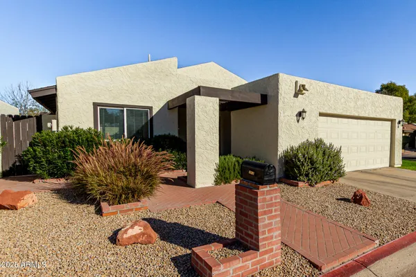 a view of a house with patio outdoor seating