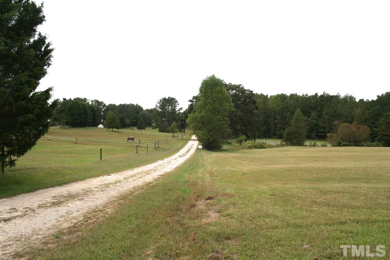 2140 Gala Farm Lane Raleigh, NC 27603 - Photo 17 of 20 a view of a swimming pool with a yard