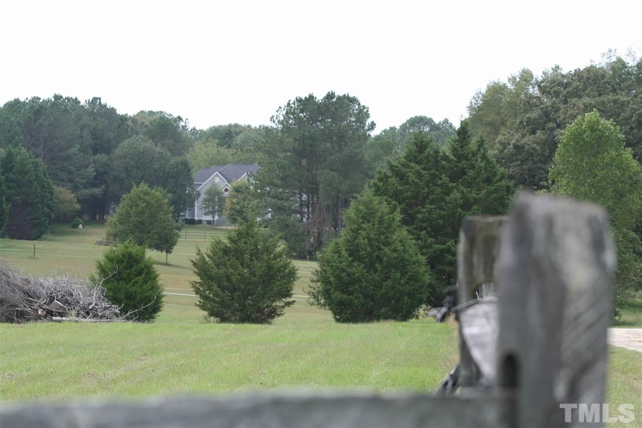 2140 Gala Farm Lane Raleigh, NC 27603 - Photo 19 of 20 a view of a garden with a building in the background