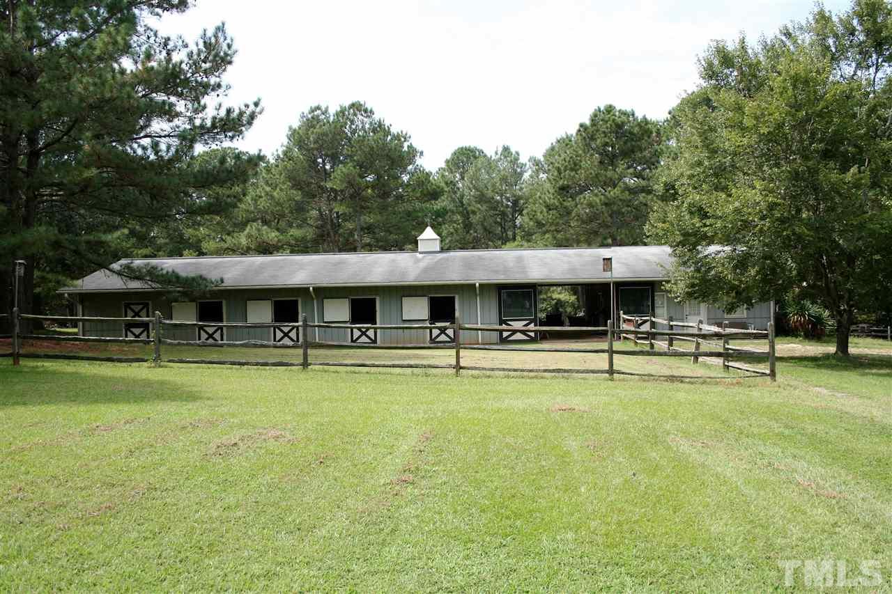 2140 Gala Farm Lane Raleigh, NC 27603 - Photo 4 of 20 a backyard of a house with table and chairs