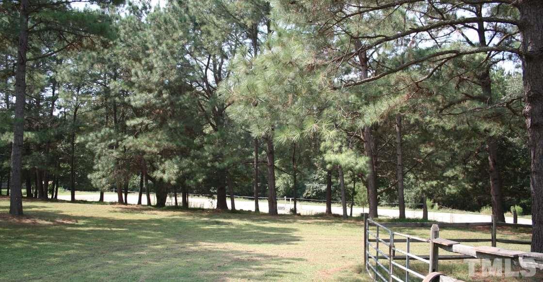 2140 Gala Farm Lane Raleigh, NC 27603 - Photo 6 of 20 a view of a swimming pool with a bench