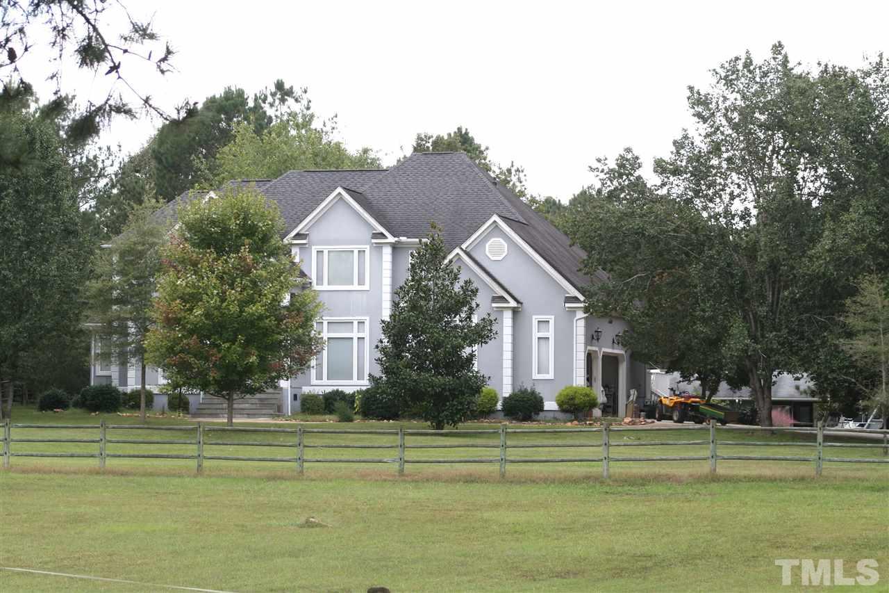 2140 Gala Farm Lane Raleigh, NC 27603 - Photo 9 of 20 a front view of a house with a garden