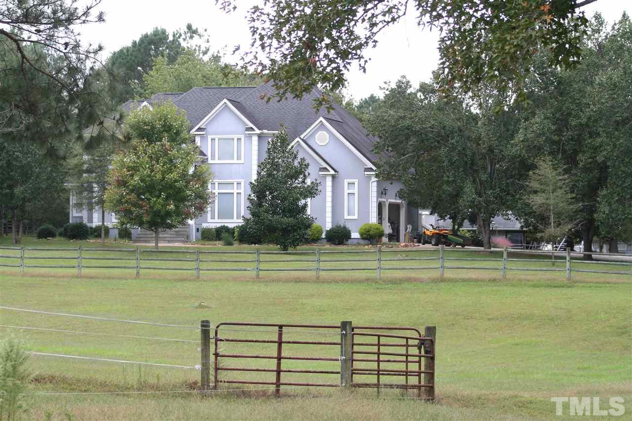 2140 Gala Farm Lane Raleigh, NC 27603 - Photo 10 of 20 a view of a house with a big yard and a large trees