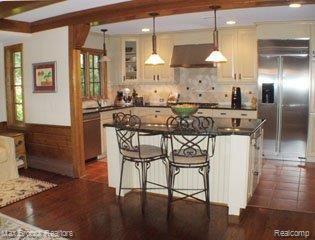 25455 Dennison Road Franklin, MI 48025 - Photo 10 of 20 kitchen island from eat in