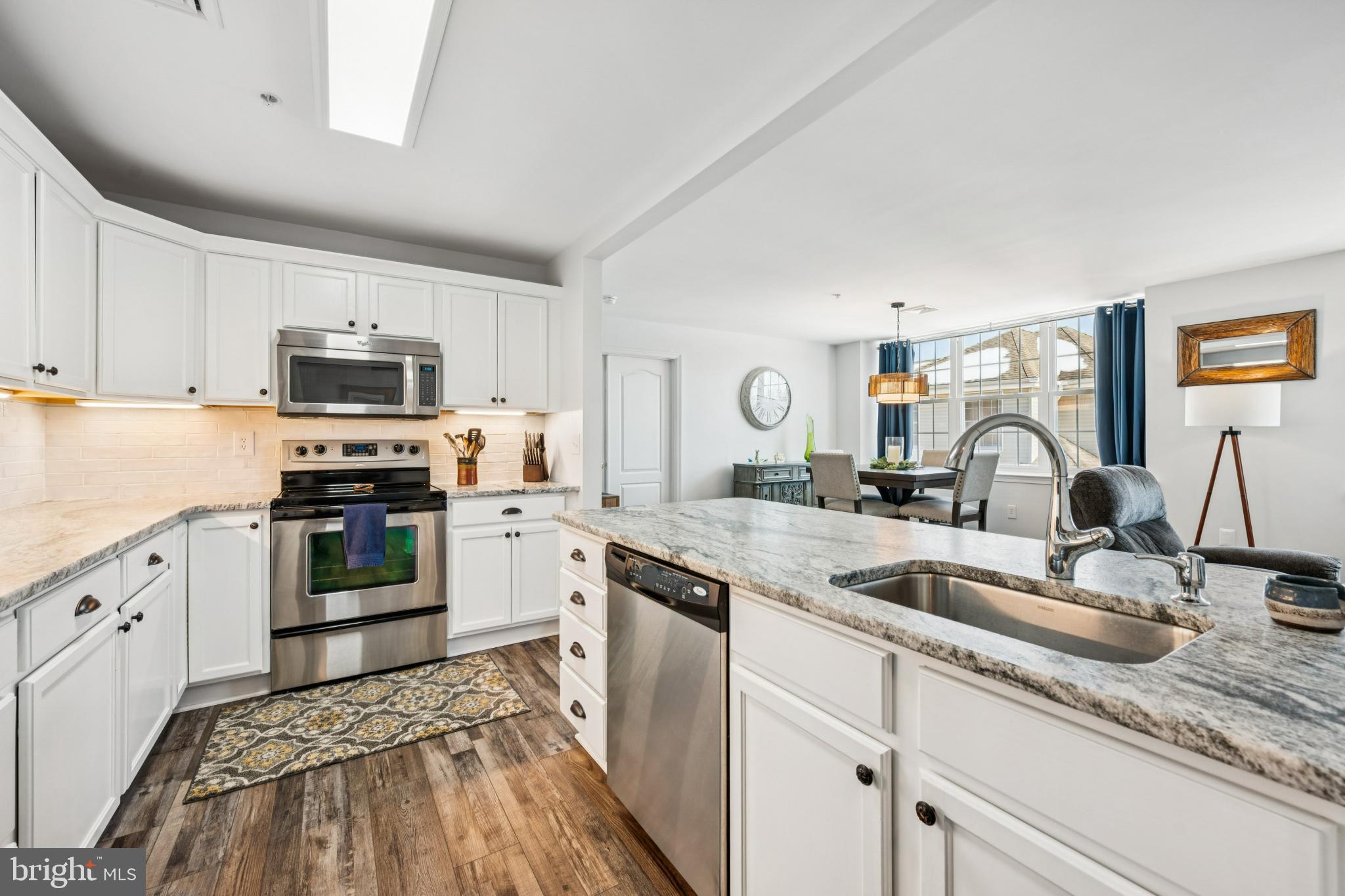 Modern kitchen with sleek finishes and light.