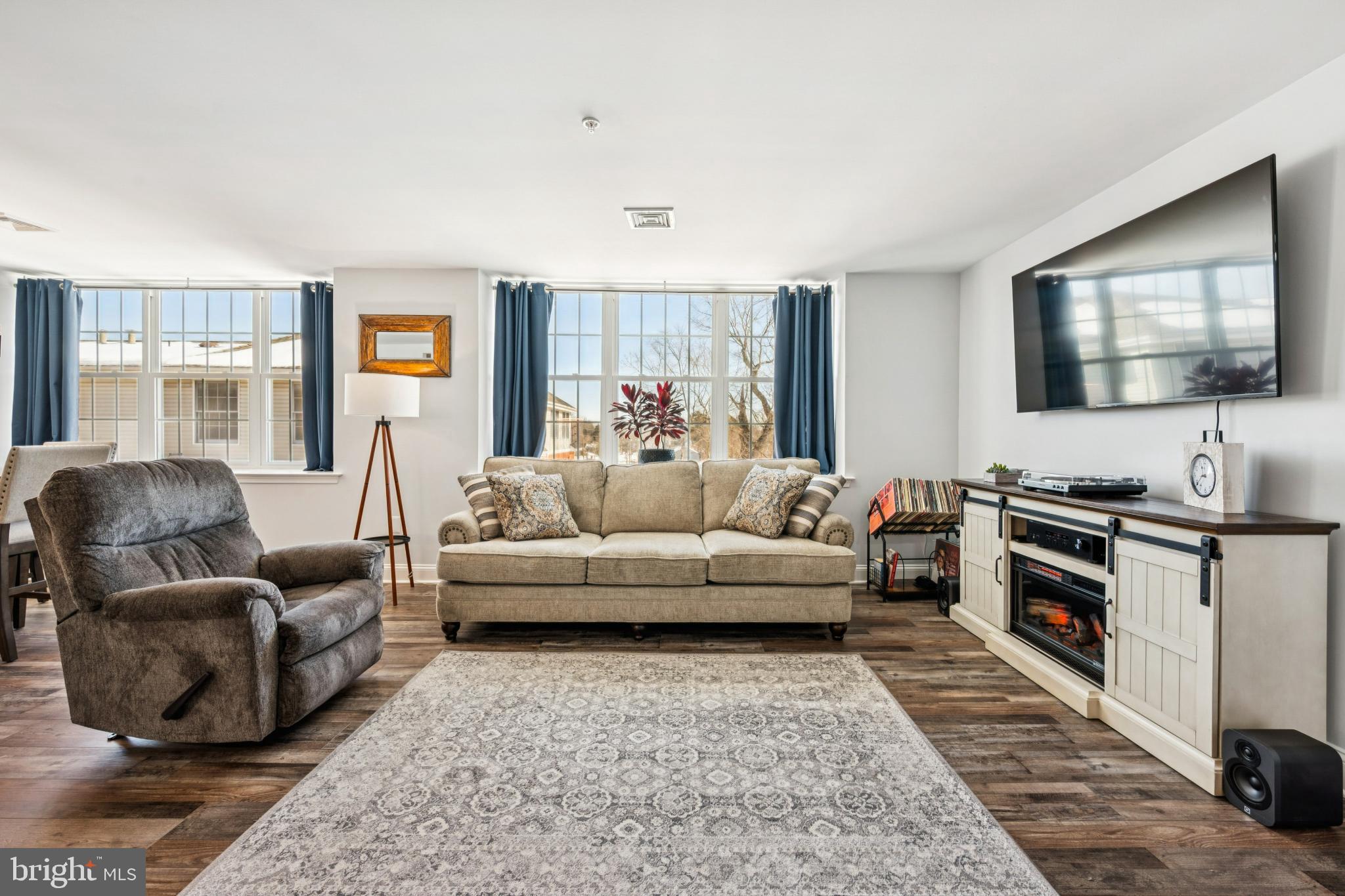 100 Aura Road, Unit 410 Clayton, NJ 08312 - Photo 14 of 25 Bright and inviting living space with charm.