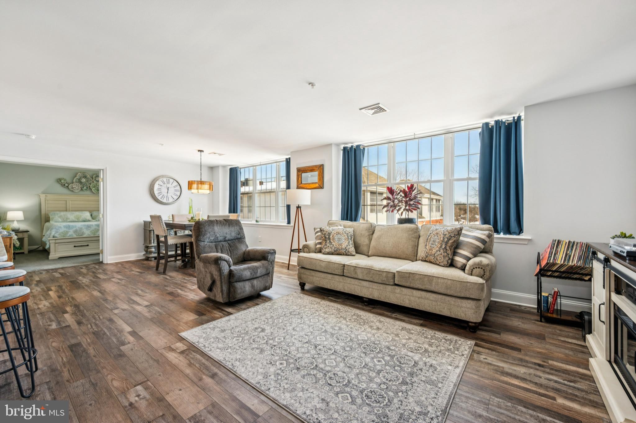 100 Aura Road, Unit 410 Clayton, NJ 08312 - Photo 15 of 25 Bright and inviting open living space.