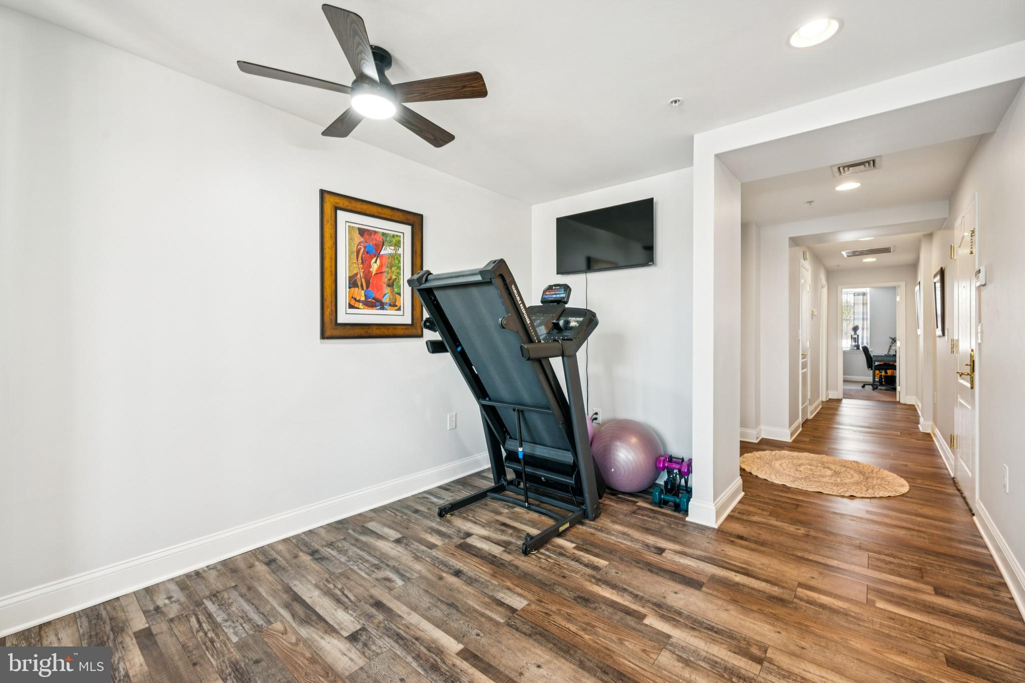100 Aura Road, Unit 410 Clayton, NJ 08312 - Photo 21 of 25 Modern fitness nook with stylish decor.