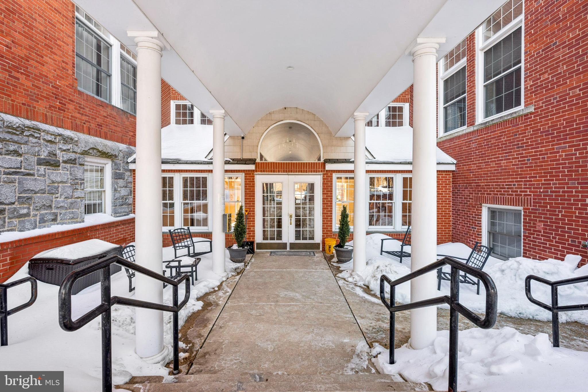 100 Aura Road, Unit 410 Clayton, NJ 08312 - Photo 24 of 25 Charming entrance framed by elegant columns.