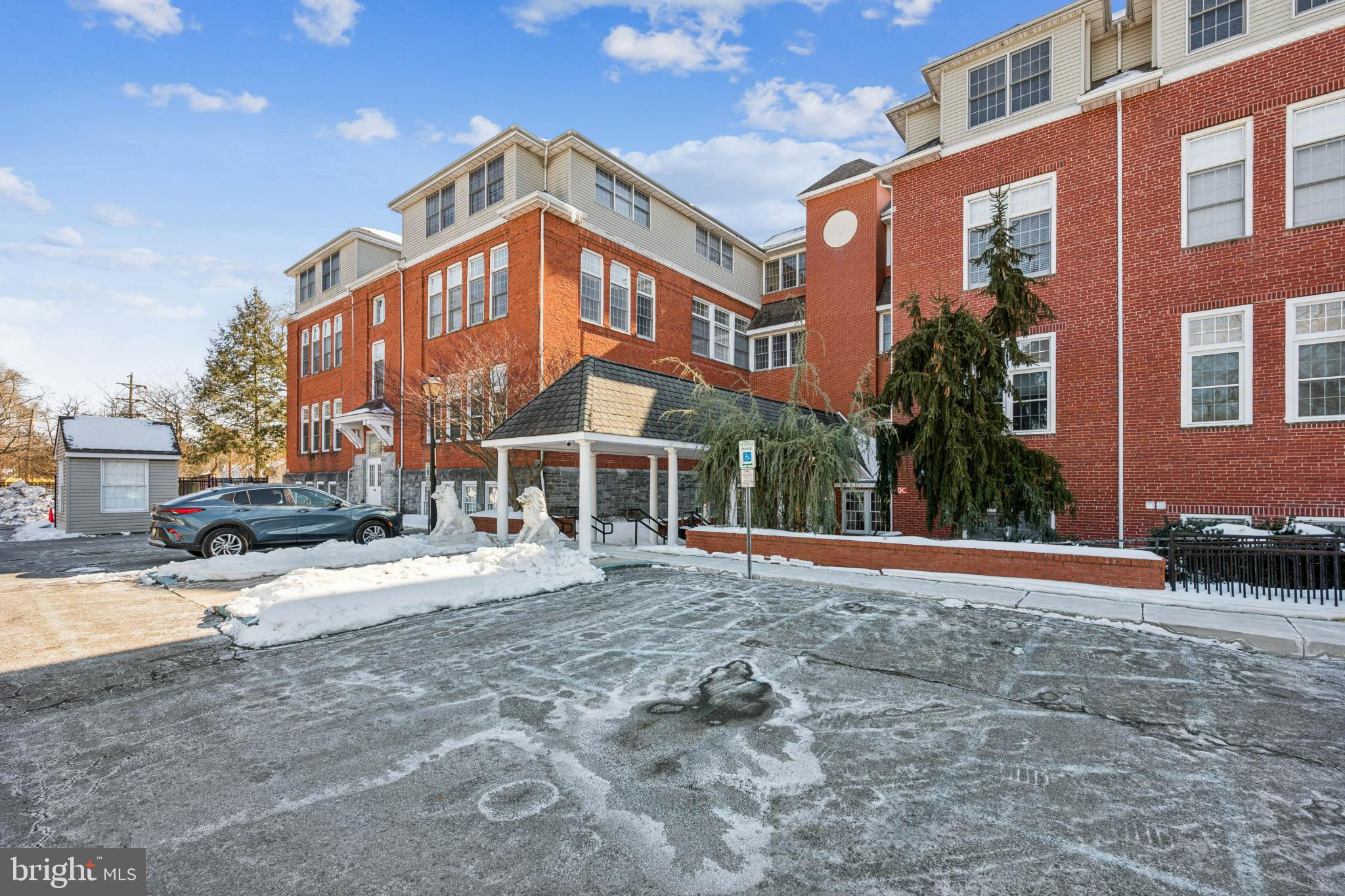 100 Aura Road, Unit 410 Clayton, NJ 08312 - Photo 25 of 25 Historic brick building in winter's embrace.