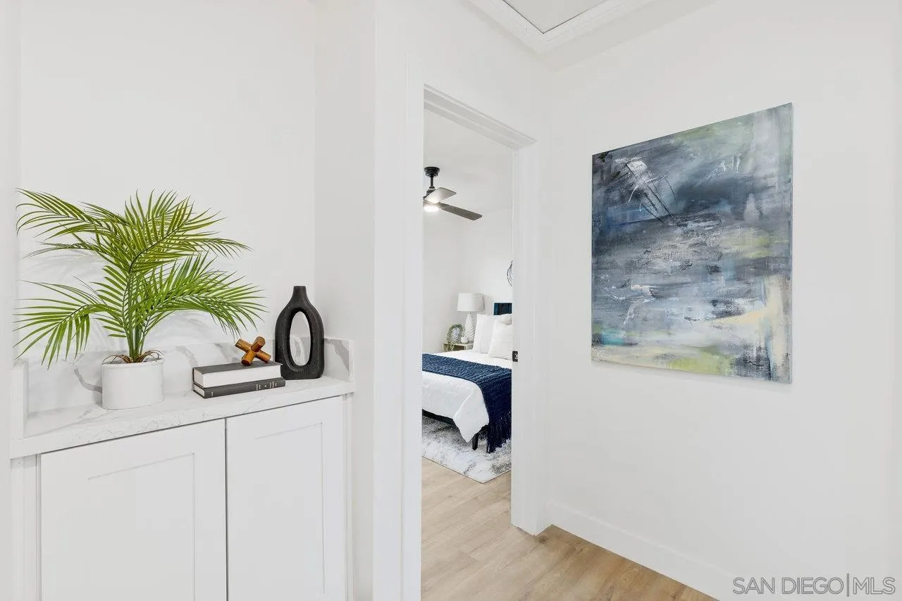 1320 Higgins Street Oceanside, CA 92058 - Photo 17 of 25 a bathroom with a sink a mirror and a potted plant