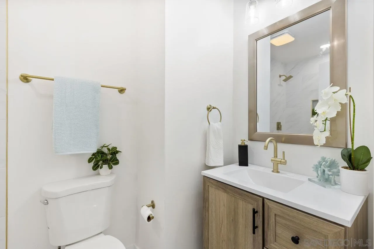 1320 Higgins Street Oceanside, CA 92058 - Photo 19 of 25 a bathroom with a sink and vanity