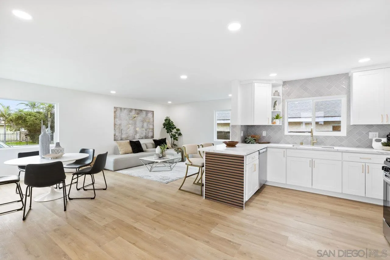1320 Higgins Street Oceanside, CA 92058 - Photo 2 of 25 a kitchen with a sink dining table and chairs
