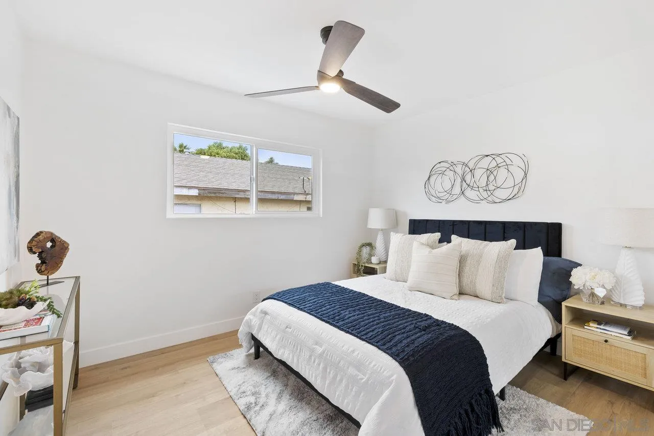 1320 Higgins Street Oceanside, CA 92058 - Photo 6 of 25 a bedroom with a bed and a table in it