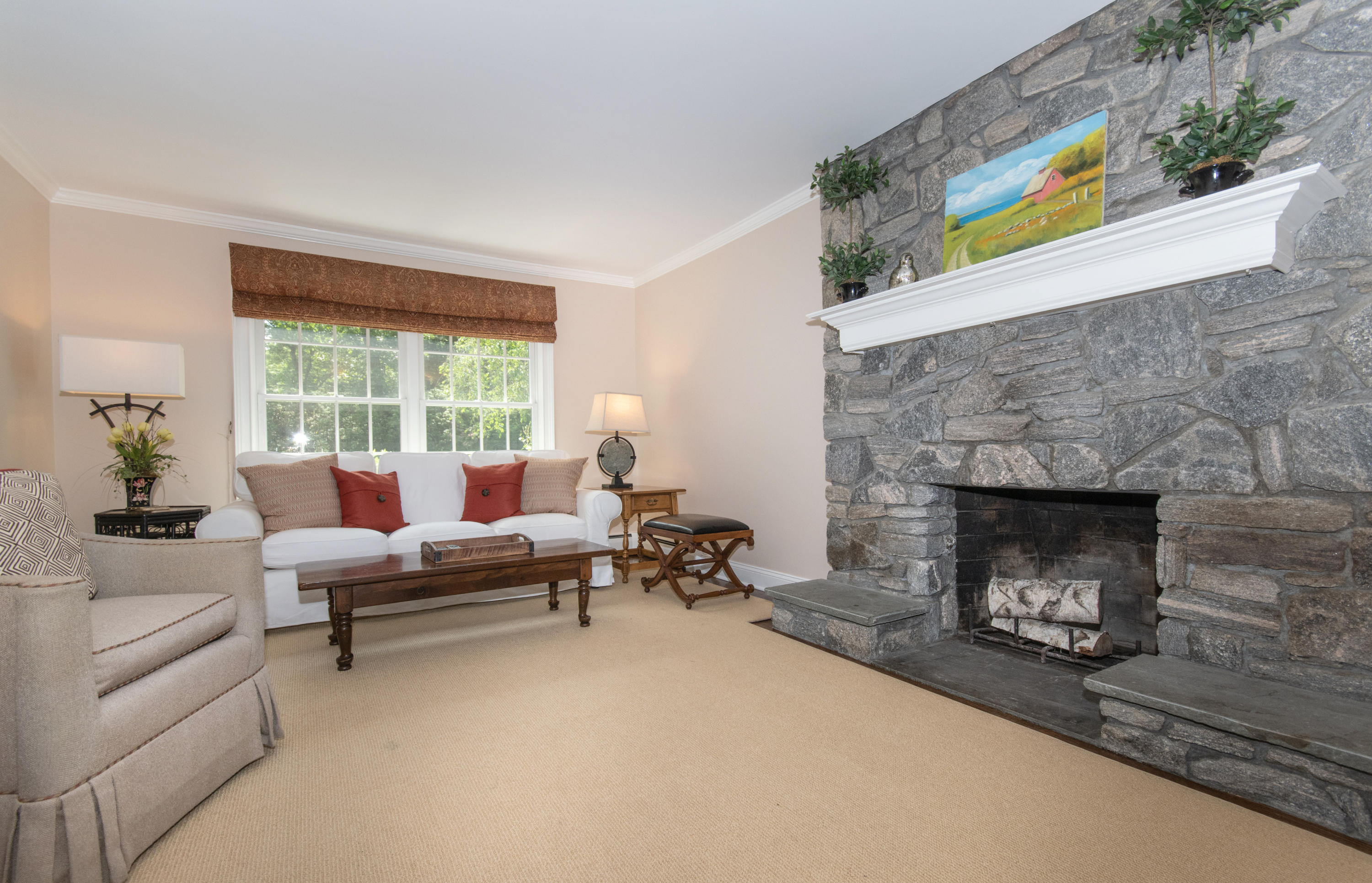 71 Rocky Brook Road New Canaan, CT 06840 - Photo 13 of 28 a living room with furniture and a fireplace
