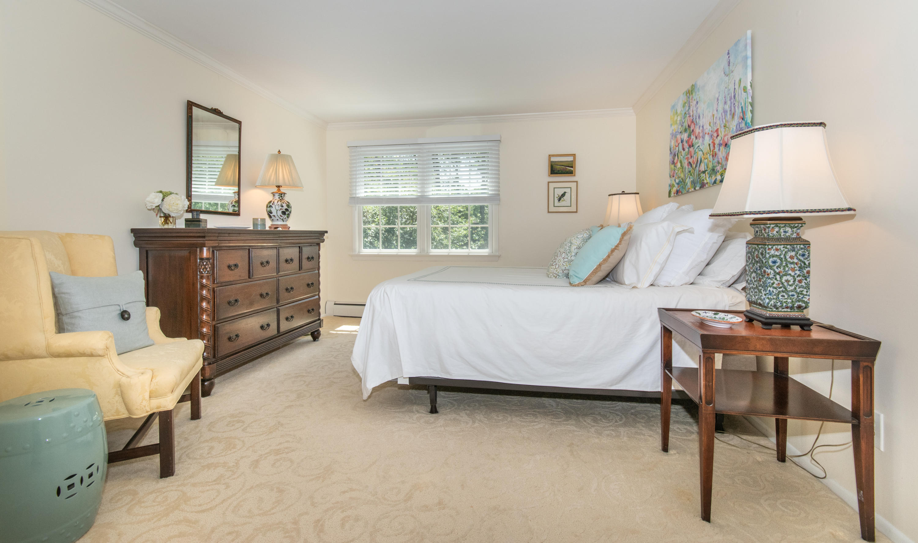 71 Rocky Brook Road New Canaan, CT 06840 - Photo 14 of 28 a bedroom with a bed and a table in it