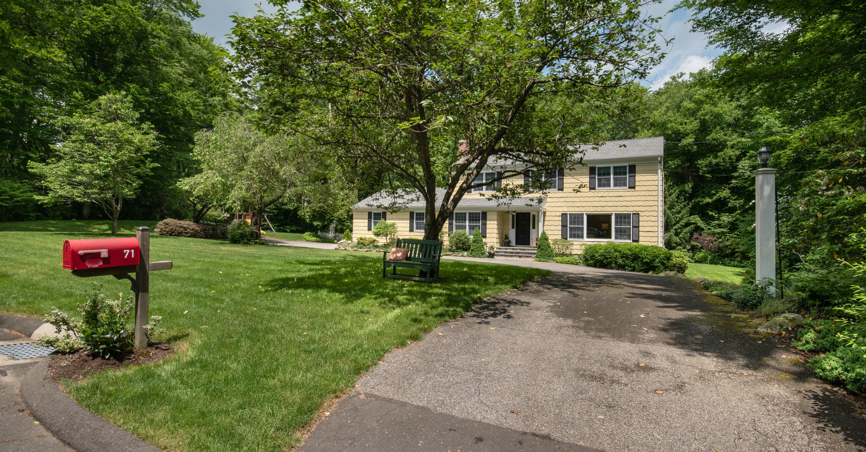 71 Rocky Brook Road New Canaan, CT 06840 - Photo 4 of 28 a view of a house with a yard