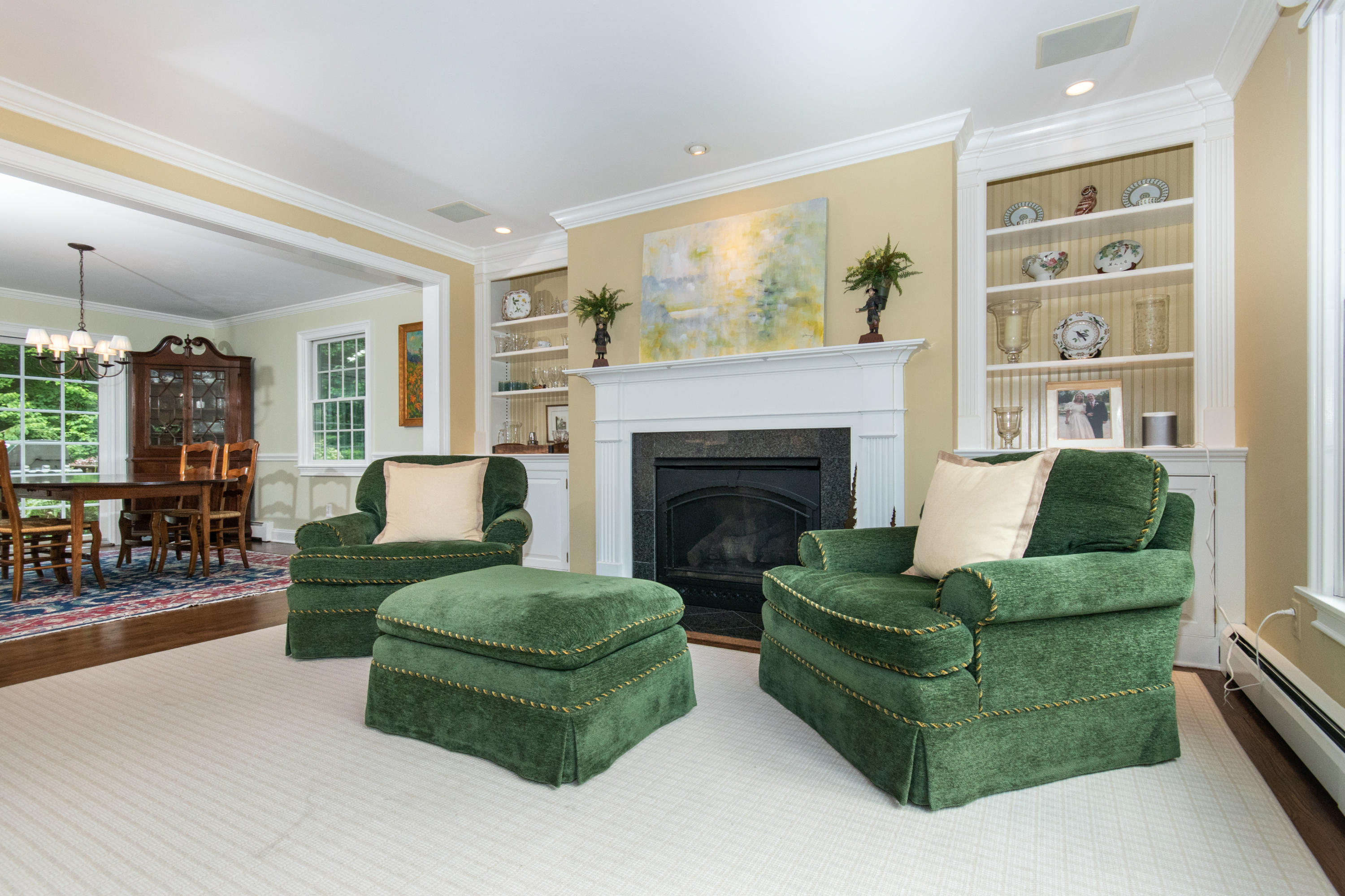 71 Rocky Brook Road New Canaan, CT 06840 - Photo 7 of 28 a living room with furniture and a fireplace