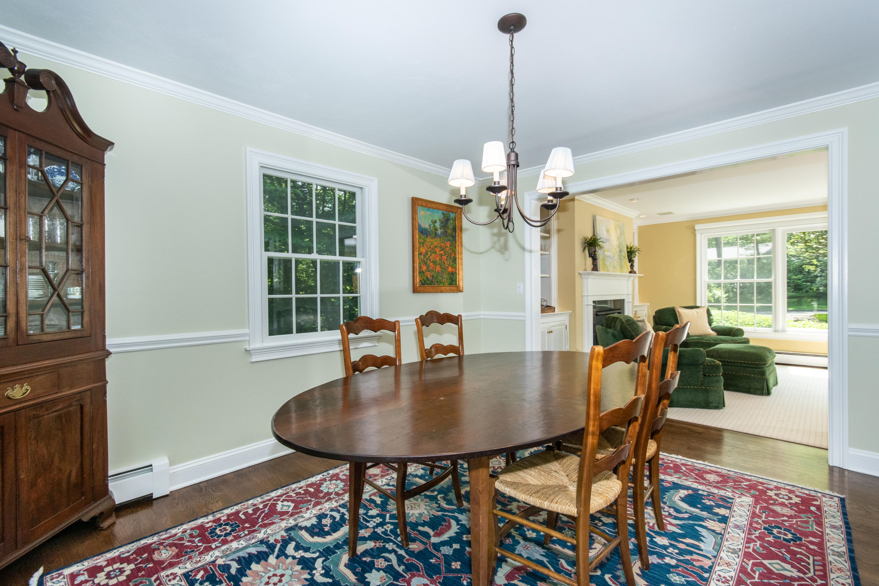 71 Rocky Brook Road New Canaan, CT 06840 - Photo 9 of 28 a view of a dining room with furniture and wooden floor
