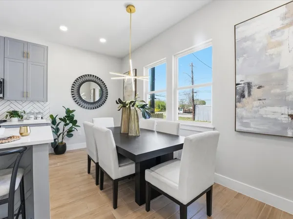a view of a dining room with furniture and window