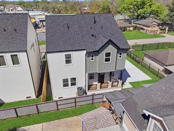 an aerial view of a house with swimming pool