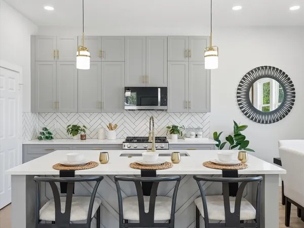 a kitchen with a table and chairs in it