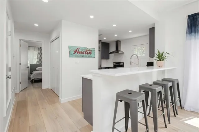 a kitchen with a table and chairs in it