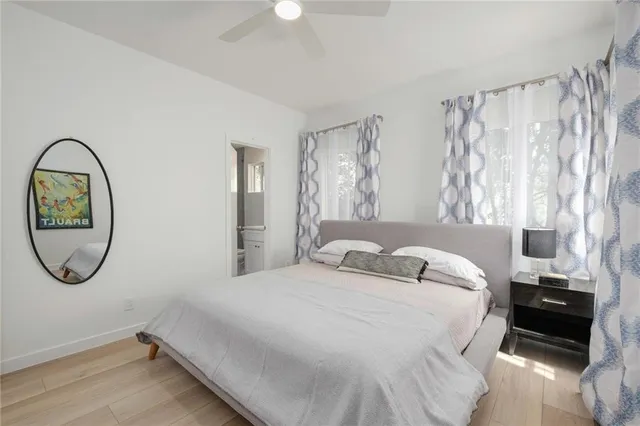 a bedroom with a bed and a window