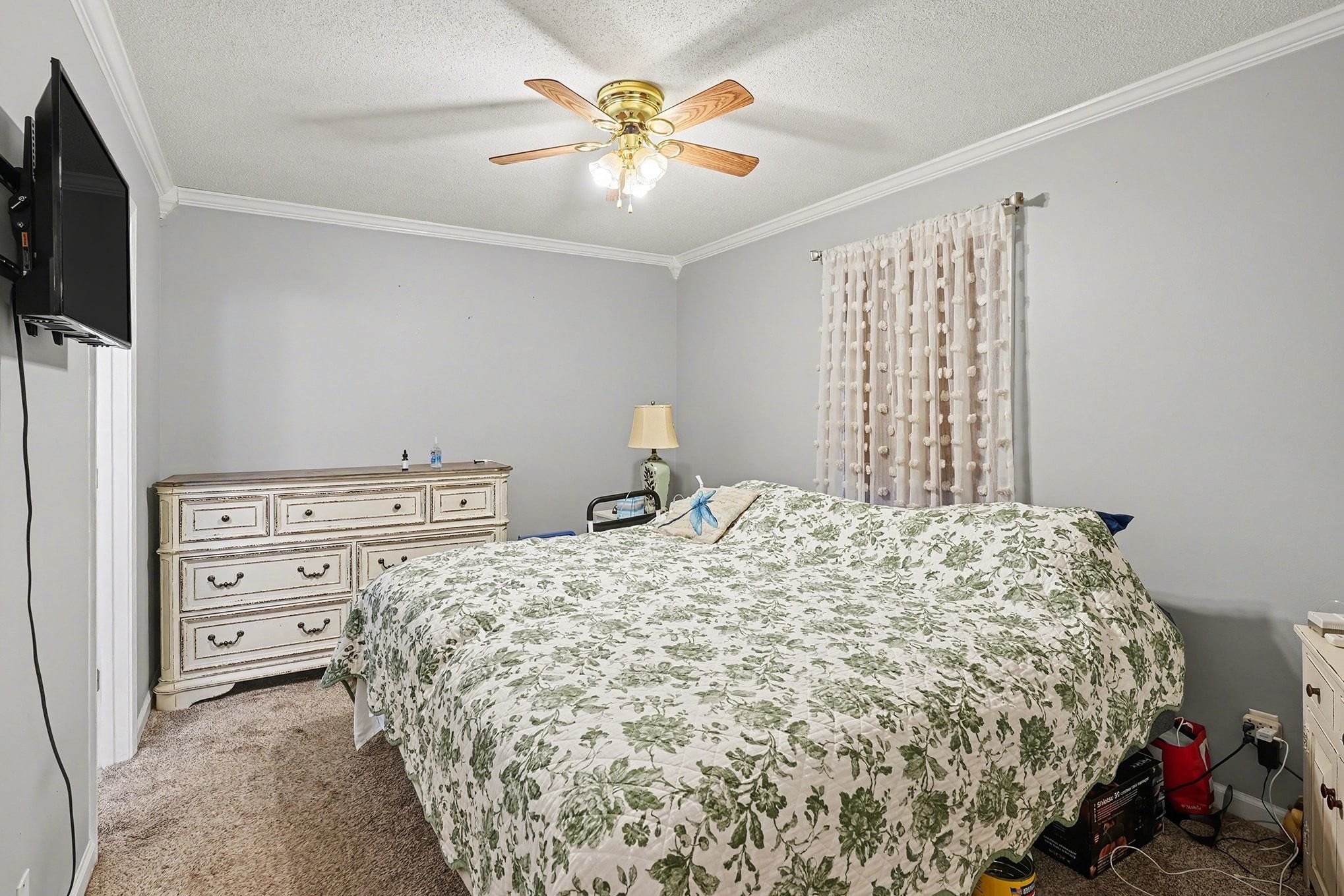 4918 Woodrow Road Woodlawn, TN 37191 - Photo 14 of 28 a bedroom with a bed and a television