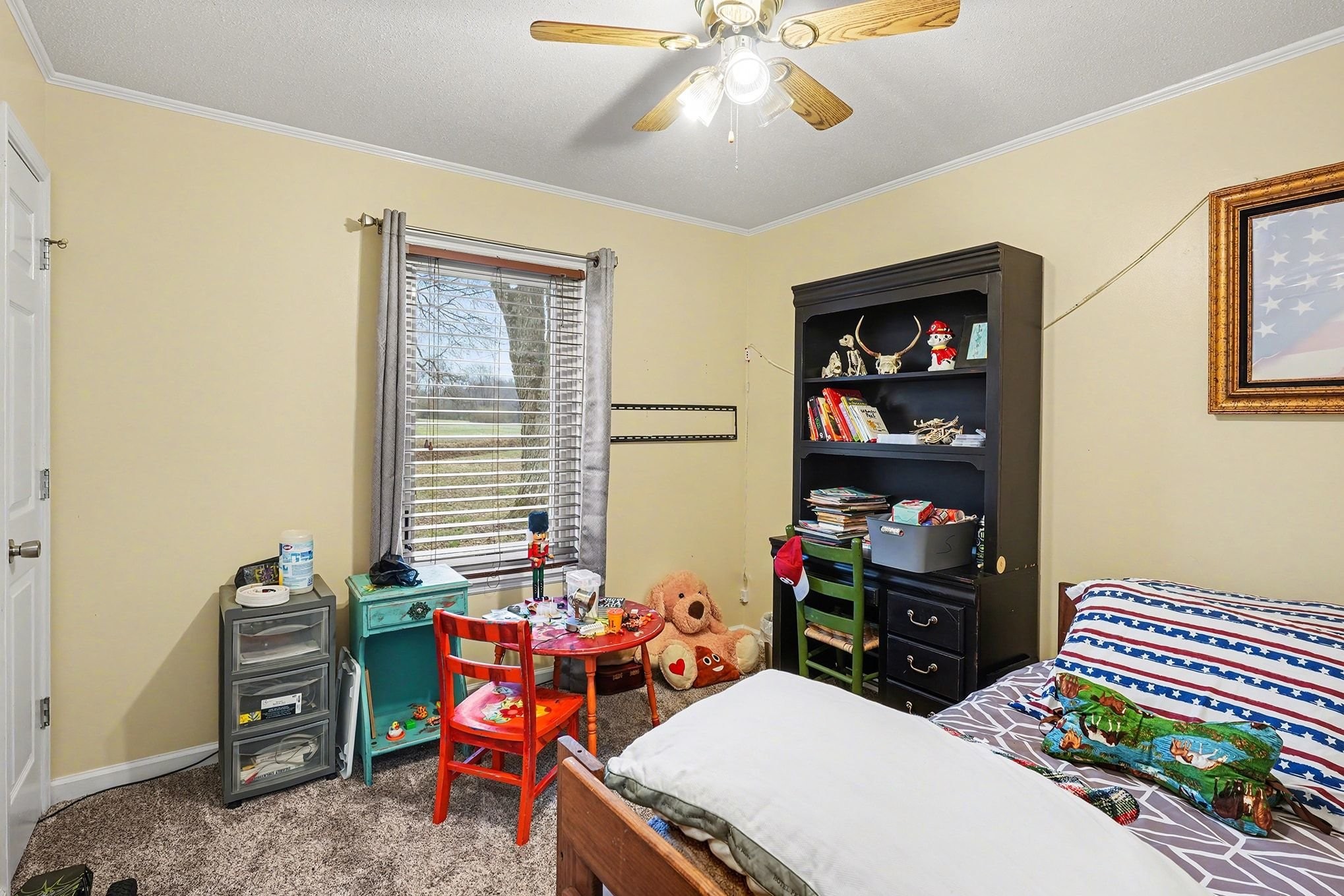4918 Woodrow Road Woodlawn, TN 37191 - Photo 17 of 28 a room with furniture a chandelier and a window