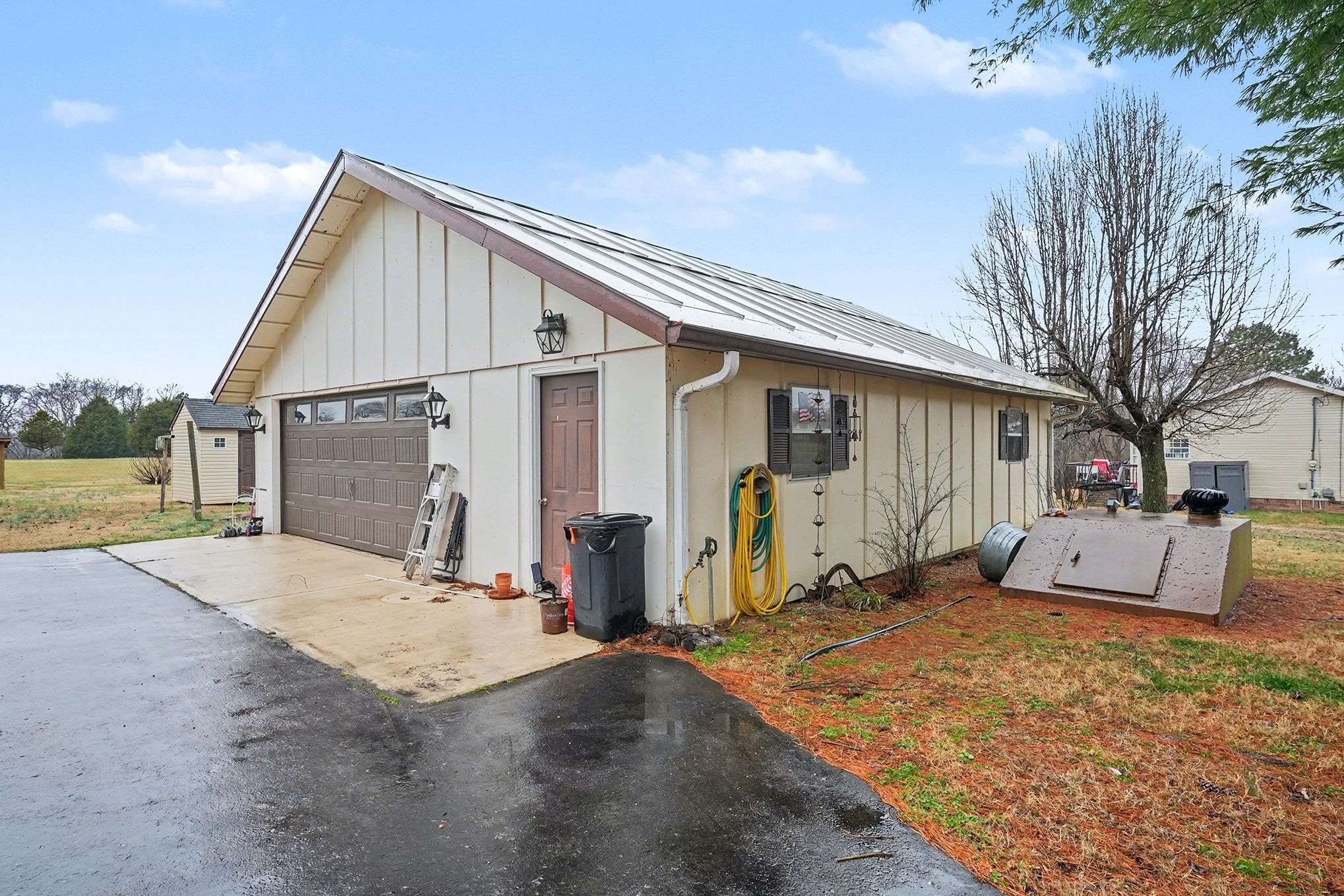 4918 Woodrow Road Woodlawn, TN 37191 - Photo 25 of 28 a view of a house with backyard and sitting area
